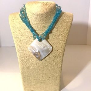 Blue necklace blue plastic seed beads shell pendant  gold